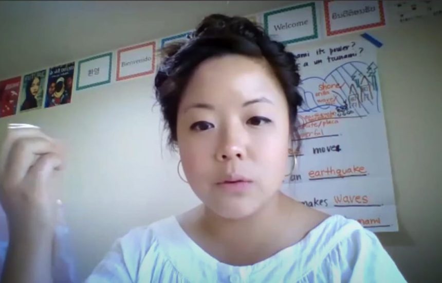 A woman talks on a virtual meeting