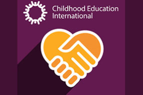 CE International white logo on a purple background with an orange icon of a handshake in the shape of a heart
