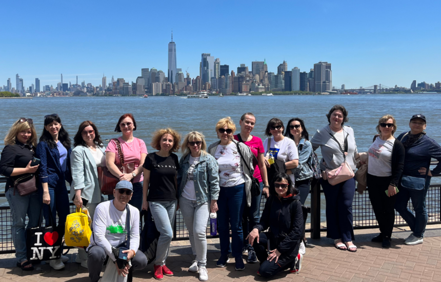 Photo of Ukrainian faculty members in front of the NYC skyline
