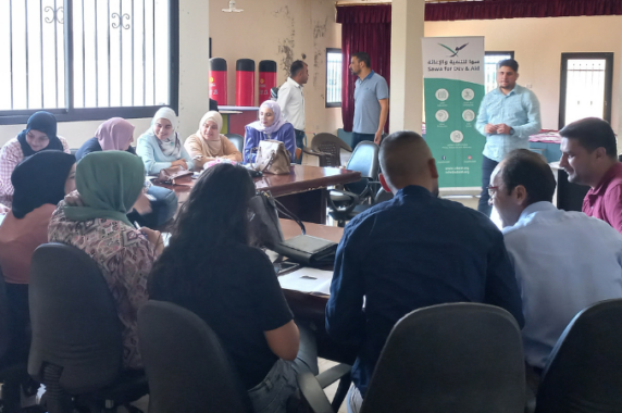 A group of refugee educators taking part in the QHL Project gather to learn and share with each other