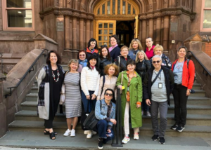 Ukrainian educators standing outside a library in New York City