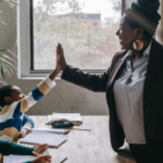 Teacher high-fiving a student