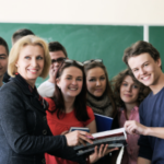 Smiling teacher with high school studnets
