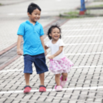 Happy girl and boy holding hands