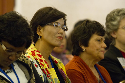 Educators wearing different traditional clothing attending a session.