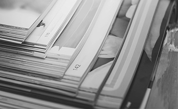 A black-and-white photo of magazines.