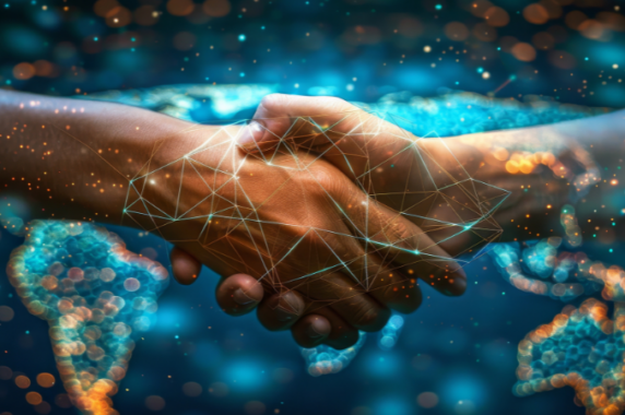 Image of a handshake in front of a sparkly blue background representing the world and business-child development partnerships.