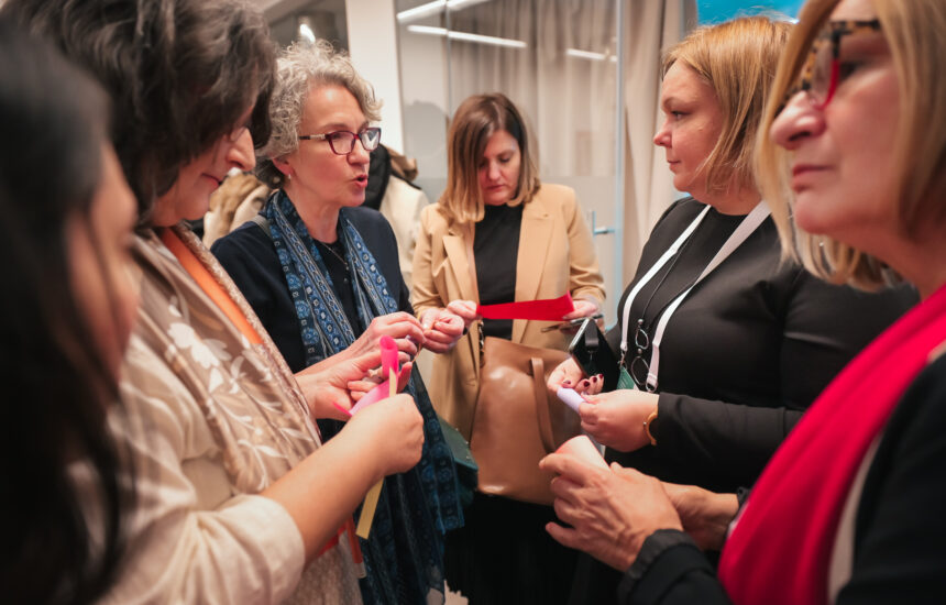 Conference attendees speaking with each other.