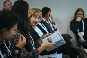 Conference attendees reviewing the guidelines document.